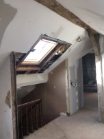 New skylight over the stairwell with entrance to master suite beyond.